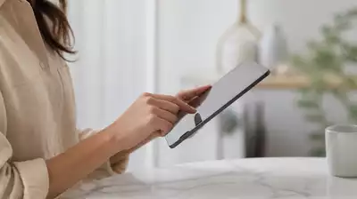 User submitting online form on tablet